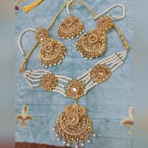 An Intricate Design Of Champagne Zircon Stones With Pearls Jewlery Set